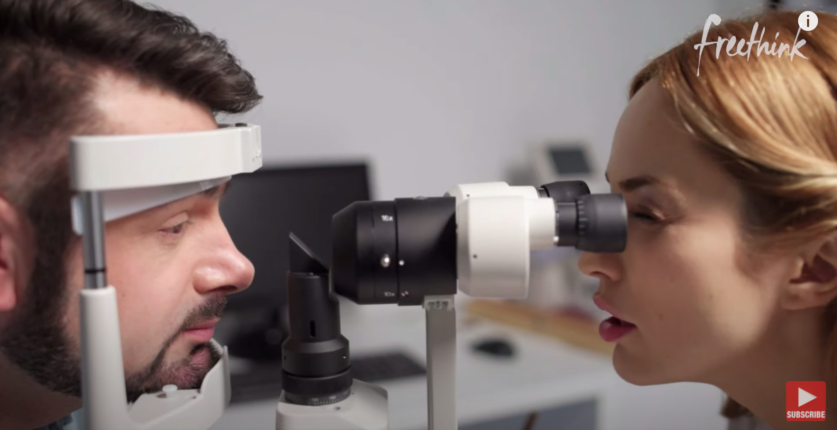 An optometrist conducts an eye exam on a man