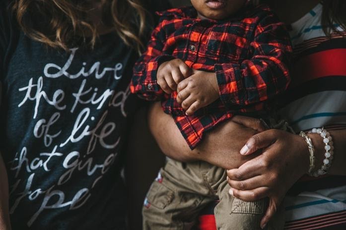 A women holds a baby