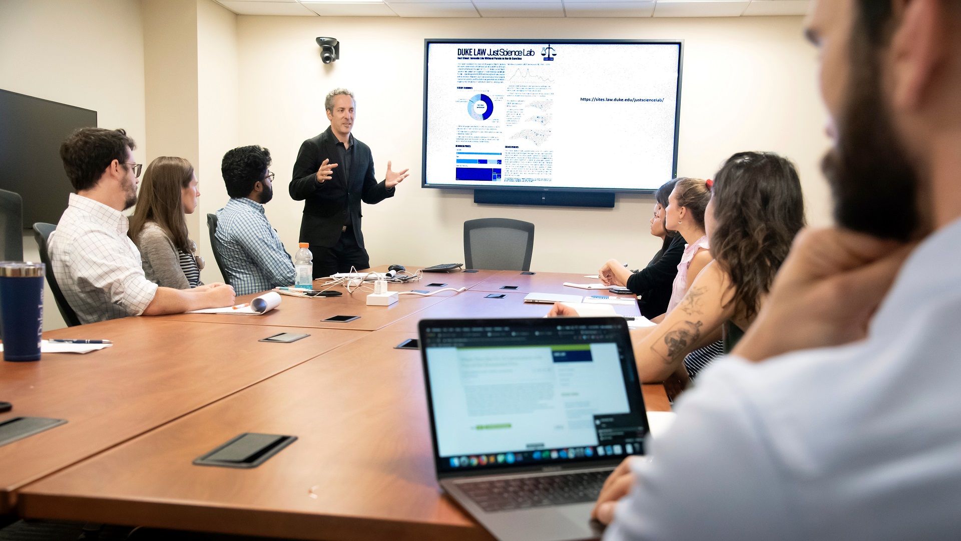 A person giving a presentation in a meeting room