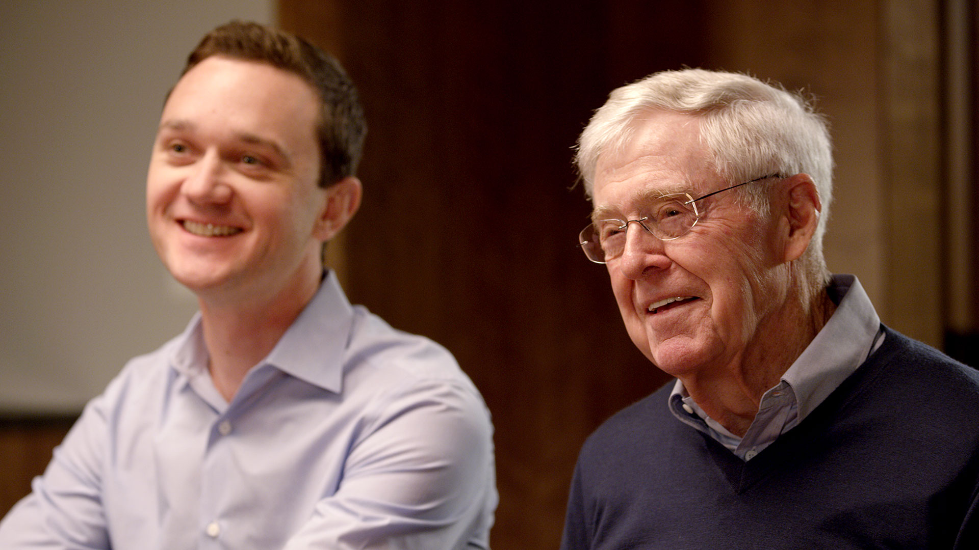 Charles Koch and Brian Hooks smiling