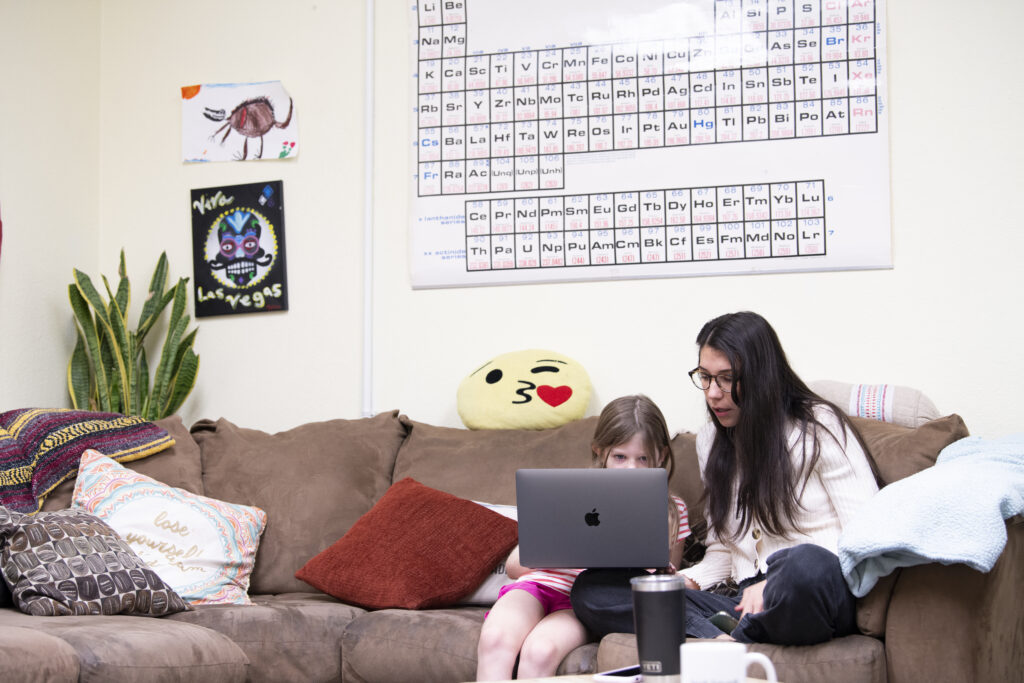 parent sitting down with her child, showing the importance of parent engagement in schools