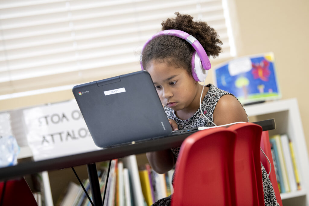 Child using a blended learning method of education