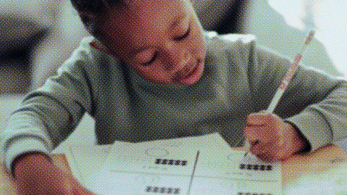 A child at Canary Academy working on an assignment